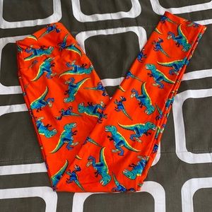 LuLaRoe Orange Leggings with Blue & Green Dinosaur Print